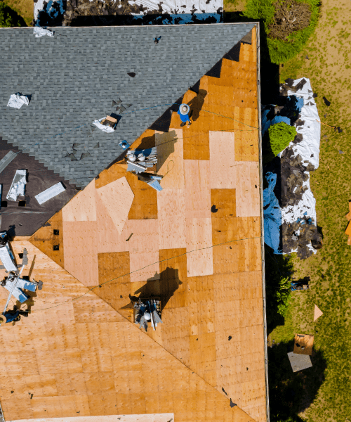 Image of a roof being repaired by licensed roof contractors