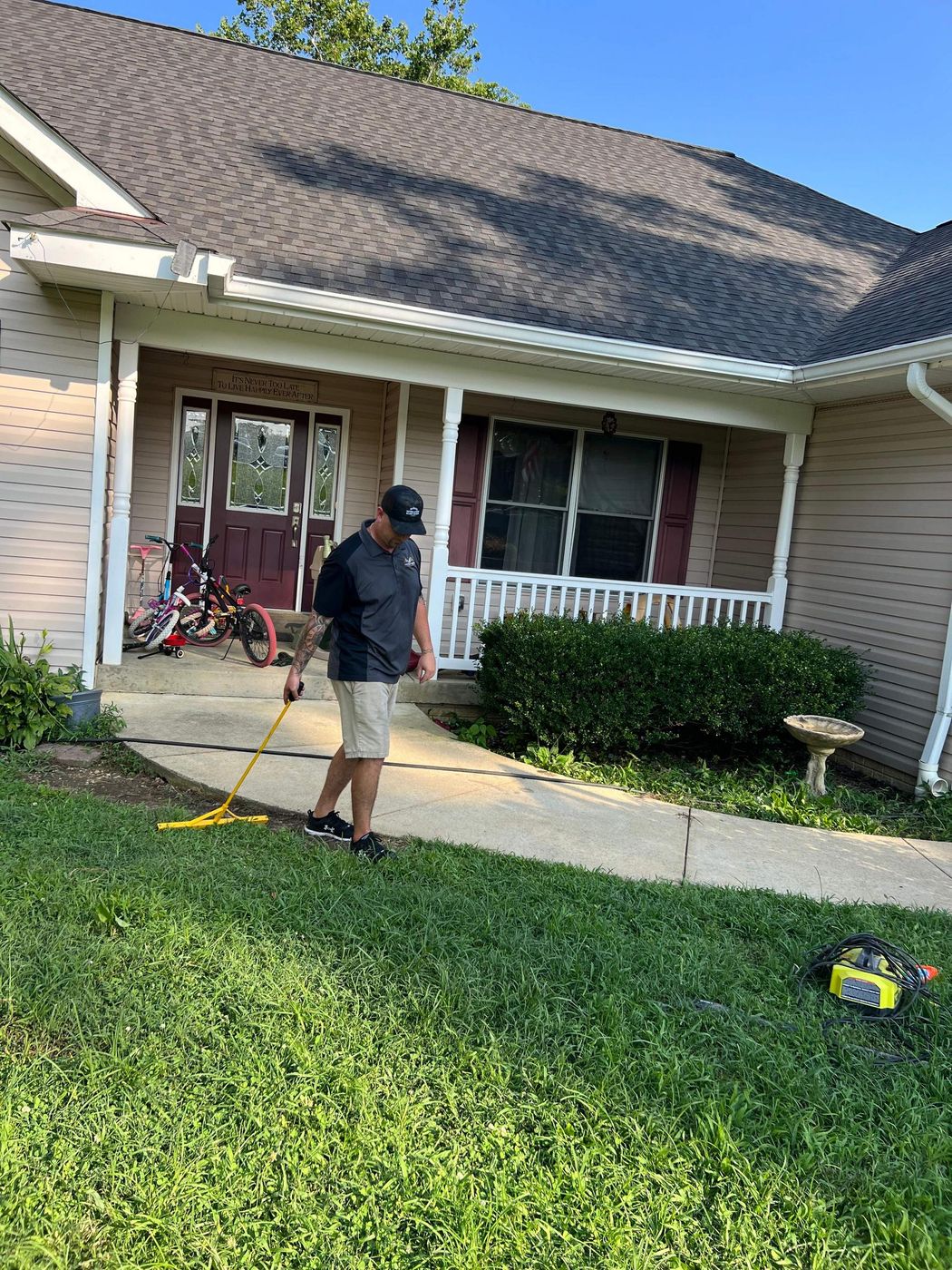 One Vision Roofing team member walking up to a home's front porch