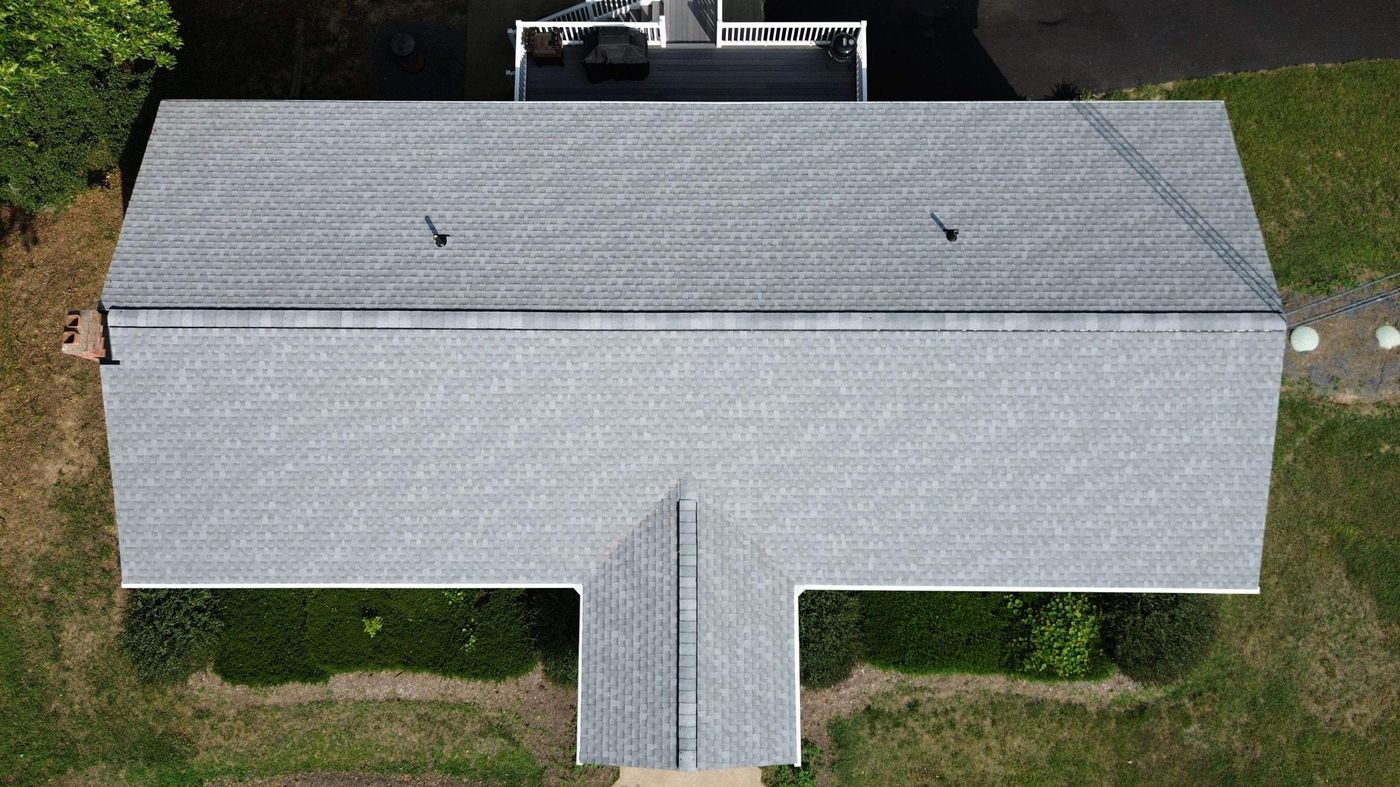 Aerial view of a gray shingle roof on a single-story home