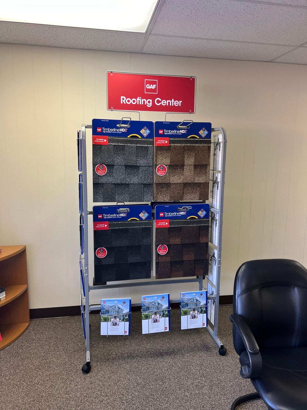 GAF shingle samples on a display rack