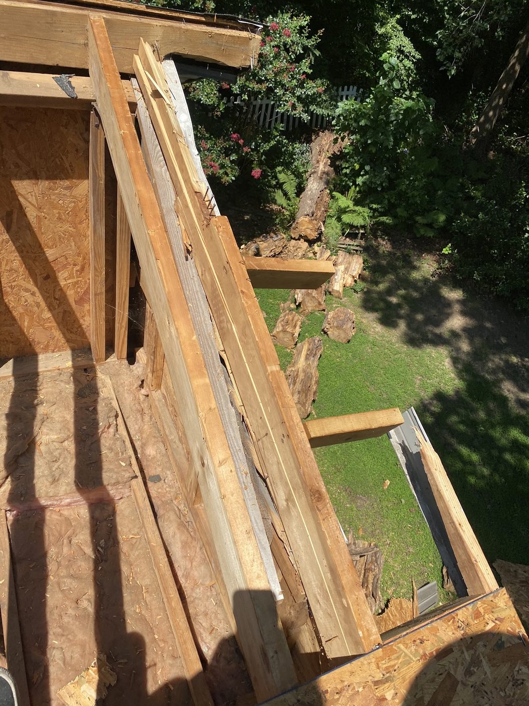 Roof framing and decking exposed during a roofing project